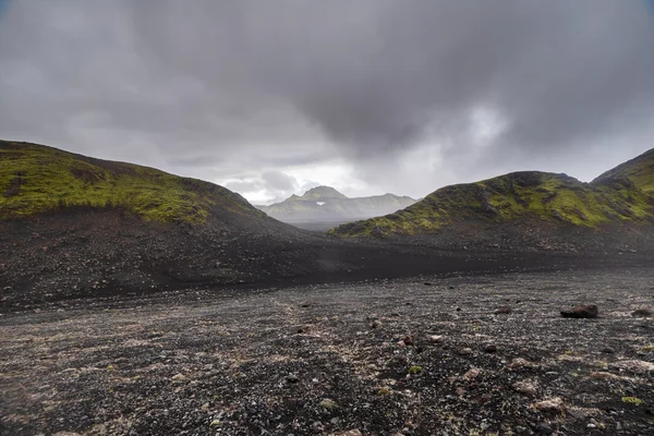 Dark Iceland landscape with green moss and black road, Iceland — Φωτογραφία Αρχείου