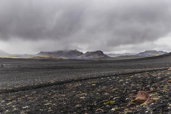 Dark Iceland landscape with green moss and black road, Iceland — Φωτογραφία Αρχείου