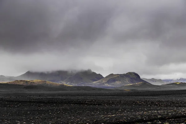 Dark Iceland landscape with green moss and black road, Iceland — Φωτογραφία Αρχείου