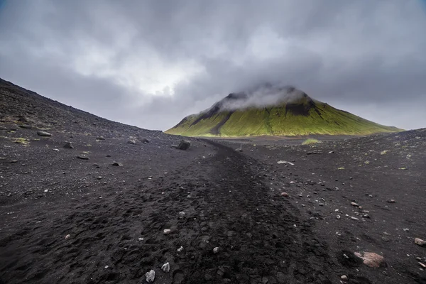 Dark Iceland landscape with green moss and black road, Iceland — Φωτογραφία Αρχείου