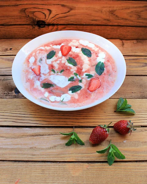 Orange strawberry cold soup with mint