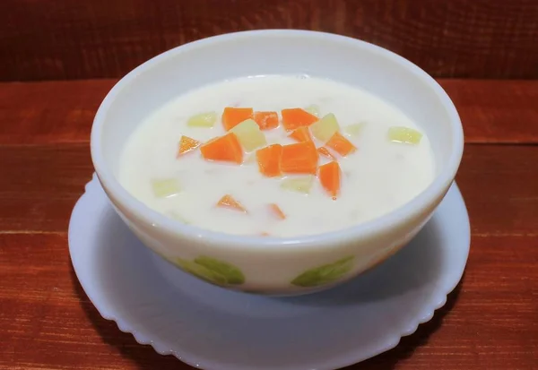 Milk soup with potatoes and carrots dietary dish