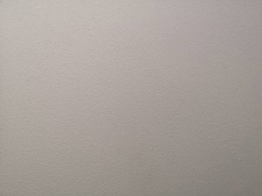 Beton sıva arka planında cilalanmış yüzeyin krem rengi boyası