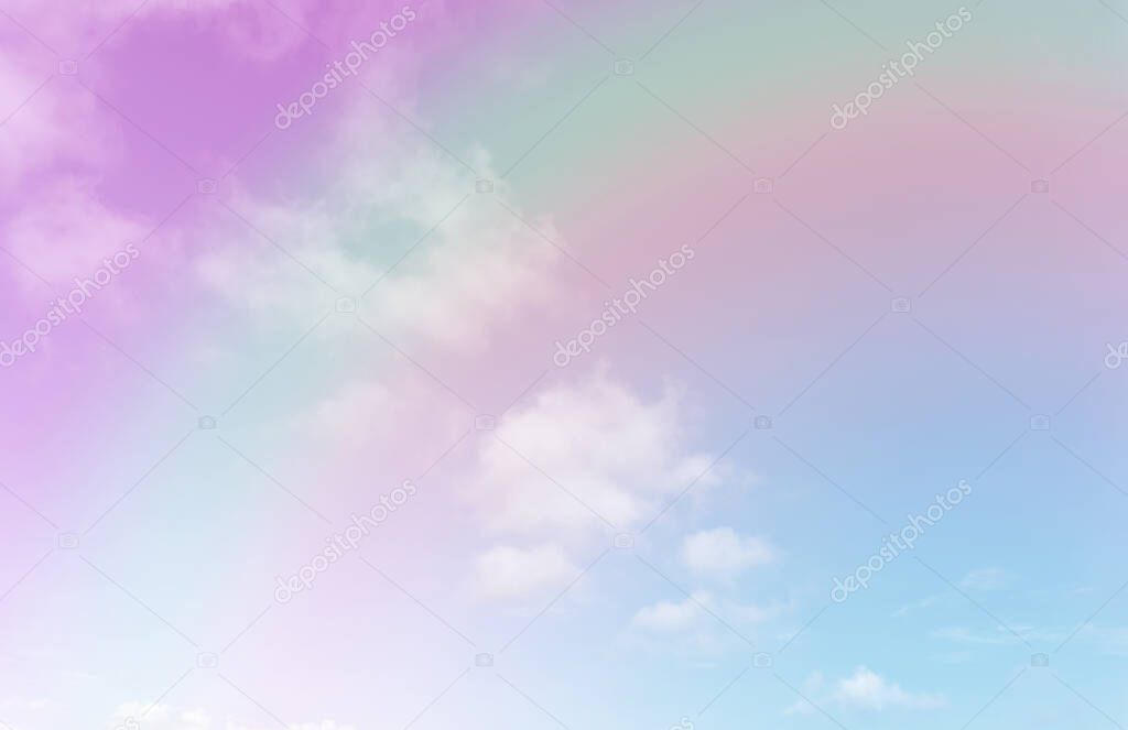 Beautiful pastel color with rainbow shade on white fluffy clouds, colorful blue sky on background, upward view and copy space image
