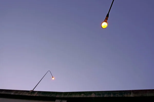 Two pole light on the super highway under dark blue sky in evening background, worm eyes view photo