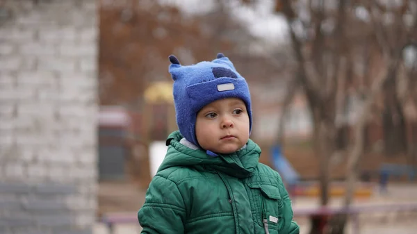 Portrait Little Cute Boy Green Jacket Funny Hat Horns Park — Stock Photo, Image