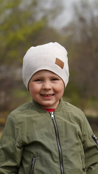 Portrait Little Cute Boy Green Jacket White Hat Spring Park — Stock Photo, Image