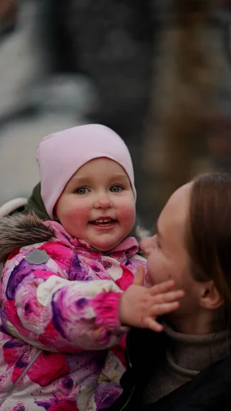 Beautiful Young Mom Cute Daughter Colourful Jacket Hood Playground Spring — Stock Photo, Image