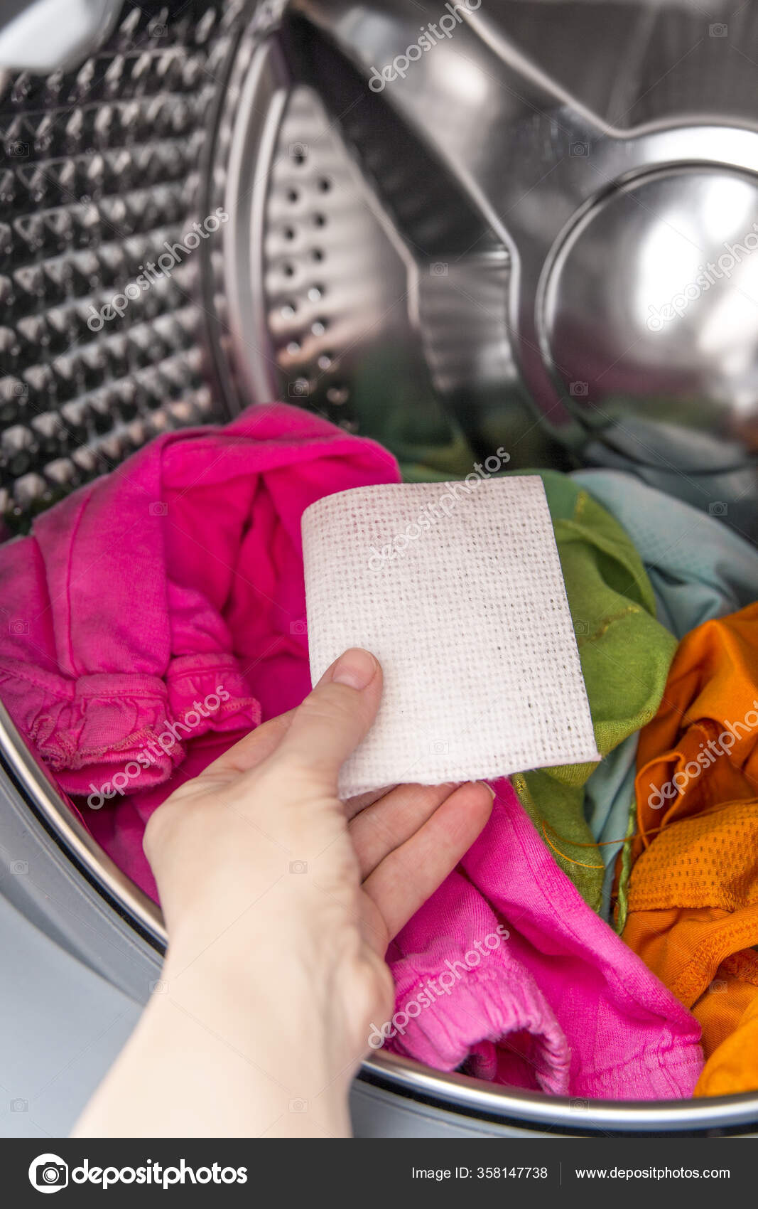 Woman Hand Put Color Absorbing Sheet Washing Machine Allows Wash