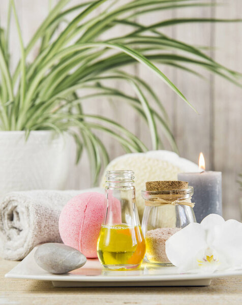 Beauty spa salon menu background minimal set. Bathroom products on light minimal wooden background. Harmonic luxury lifestyle concept. Towel, candles, bath salt, aroma massage oil in bottle.