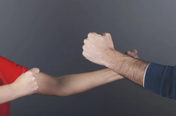 angry woman and man  fists on dark background