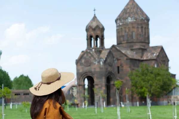 fashion woman in the church background under sky