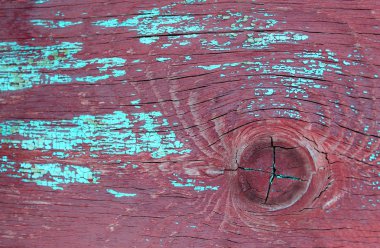 Ahşap üzerinde eski boya kalıntıları olan eski ahşap bir arka plan. Eski bir ağacın dokusu, boyalı bir tahta, eski model arka plan soyma boyası. Kırık boyalı eski mavi tahta, eski model