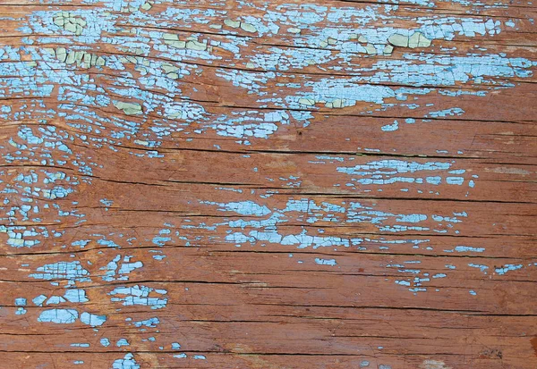 Alter Holzhintergrund mit Resten von Fetzen alter Farbe auf Holz. Textur eines alten Baumes, Brett mit Farbe, Vintage-Hintergrundfarbe abblätternd. alte blaue Tafel mit rissiger Farbe, Jahrgang — Stockfoto