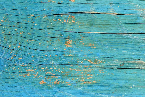 Fundo de madeira velho com restos de pedaços de restos de tinta velha em madeira. Textura de uma árvore velha, placa com tinta, fundo vintage descascando tinta. placa azul velha com tinta rachada, vintage — Fotografia de Stock