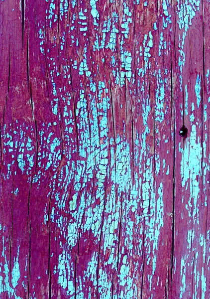 Régi fából készült háttér, régi fadarabok maradványaival. Textúra egy régi fa, tábla festékkel, vintage háttér peeling festék. régi kék tábla repedt festék, vintage — Stock Fotó