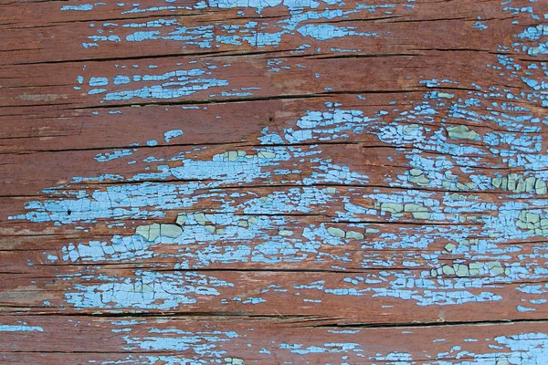 Stare drewniane tło z resztkami starej farby na drewnie. Tekstura starego drzewa, deska z farbą, vintage farba obierająca tło. stara niebieska deska z popękaną farbą, vintage — Zdjęcie stockowe