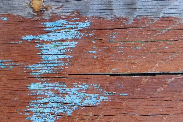 木の上の古いペイントのスクラップの部分の遺骨と古い木製の背景。古い木、ペンキ、塗料を剥離ヴィンテージ背景ボードのテクスチャ。ひびの入った古い青いボード ペイント、ビンテージ、ウー — ストック写真