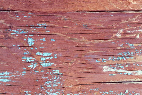 Alter Holzhintergrund mit Resten von Fetzen alter Farbe auf Holz. Textur eines alten Baumes, Brett mit Farbe, Vintage-Hintergrundfarbe abblätternd. altes blaues Brett mit rissiger Farbe, vintage, woo — Stockfoto
