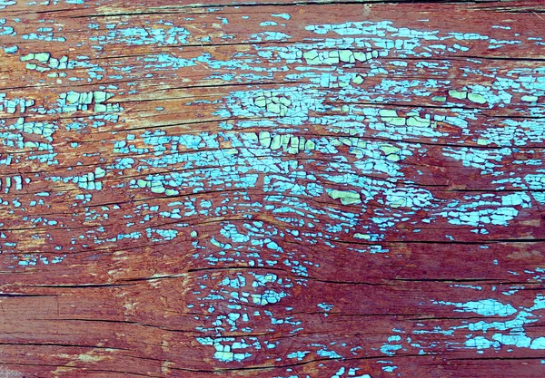 Oude houten achtergrond met resten van stukken van kladjes van oude verf op hout. Het patroon van een oude boom, bord met verf, vintage achtergrond schillen verf. oude blauwe bord met gebarsten verf, vintage, woo — Stockfoto