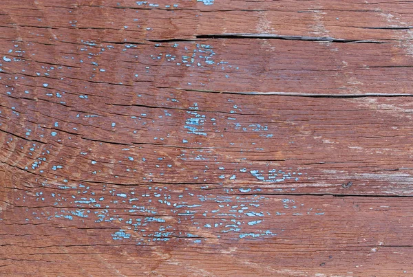 Alter Holzhintergrund mit Resten von Fetzen alter Farbe auf Holz. Textur eines alten Baumes, Brett mit Farbe, Vintage-Hintergrundfarbe abblätternd. altes blaues Brett mit rissiger Farbe, vintage, woo — Stockfoto