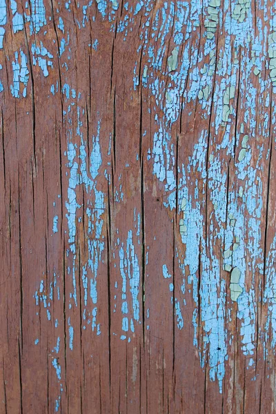 Vecchio sfondo in legno con resti di pezzi di scarti di vecchia vernice su legno. Struttura di un albero vecchio, asse con vernice, vernice di peeling di sfondo d'annata. vecchio bordo blu con vernice incrinata, annata, woo — Foto Stock