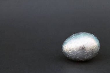 decoration Easter Gold and silver egg on black background