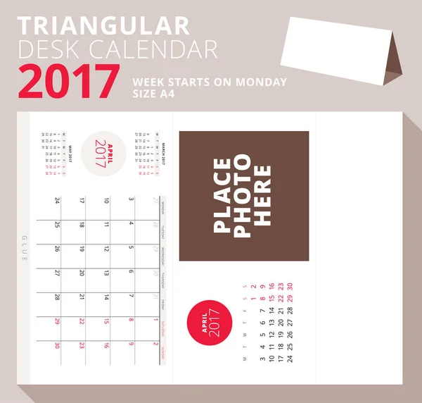 Τριγωνικό επιτραπέζιο ημερολόγιο για το έτος 2017. Απριλίου 2017. Εβδομάδα ξεκινά τη Δευτέρα. Εκτυπώσιμη χαρτικά πρότυπο με θέση για φωτογραφία. Εικονογράφηση διάνυσμα — Διανυσματικό Αρχείο