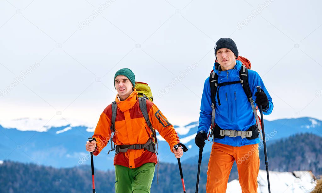 hikers in the winter mountains