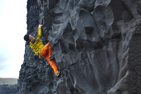 male rock climber on the cliff