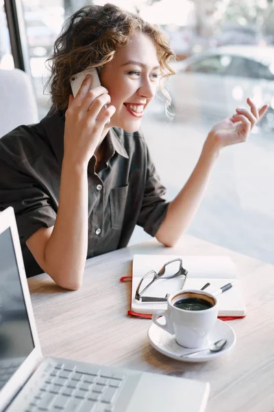 Woman with phone in cafe — Stock Photo, Image