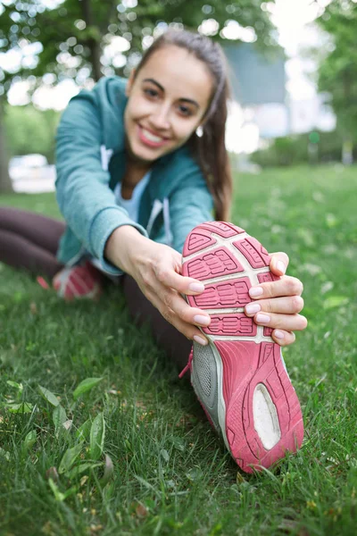 Portrait of young and sporty woman in sportswear doing yoga or Stretching exercises — Stock Photo, Image