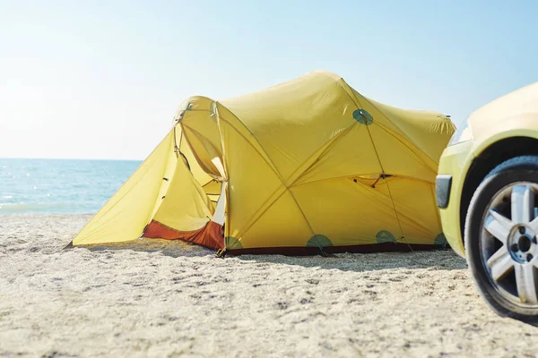 Yellow tent on the beach at bright sunny day — Stock Photo, Image