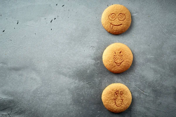 set of round cookies with different emotions, faces with emotions