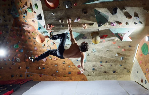 man climber climbs indoors