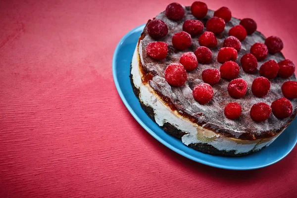 vegan cake with coconut layer, dates and cherries