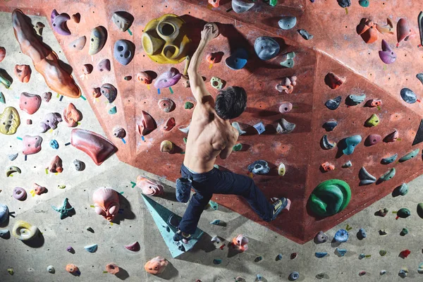 man climber climbs indoors