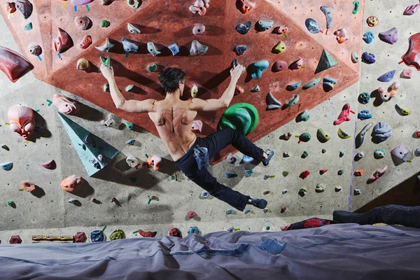 man climber climbs indoors