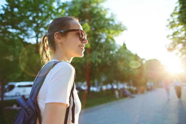 Portrait of a young attractive woman with city backpack — Stock Photo, Image