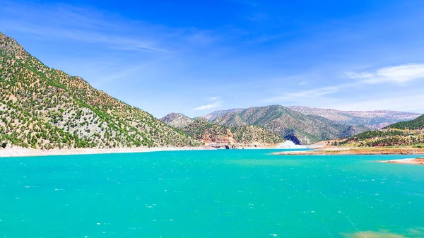 Scenic view of the lake among the mountains against the blue sky. Morocco. Adventure travel. Panorama. Top View.
