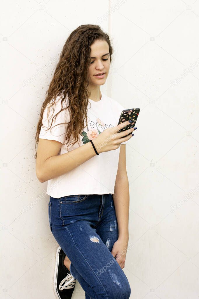 Teen student girl with mobile using social media