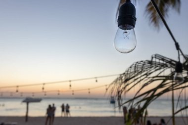 Bulb sunset on a beach clipart