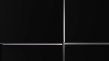 Tüm ekran hacim dalgasının yüzeyinde bir sürü siyah küp var. Küplerin birbirlerine yoğun bir şekilde yakın hareket etmesi gibi. Yavaş çekim soyut arkaplan