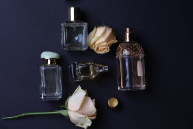 beautiful aroma perfumes set on dark background 