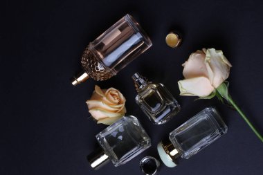 beautiful aroma perfumes set on dark background 