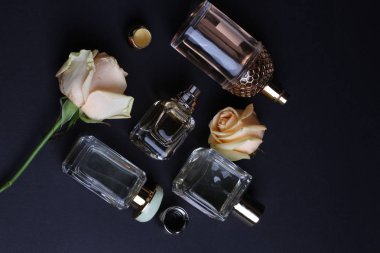 beautiful aroma perfumes set on dark background 