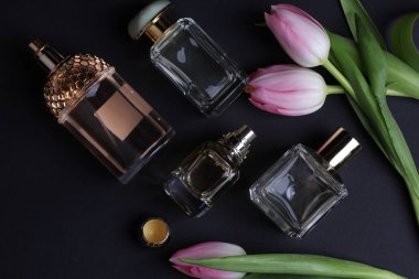 beautiful aroma perfumes set on dark background 