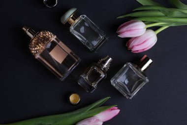 beautiful aroma perfumes set on dark background 