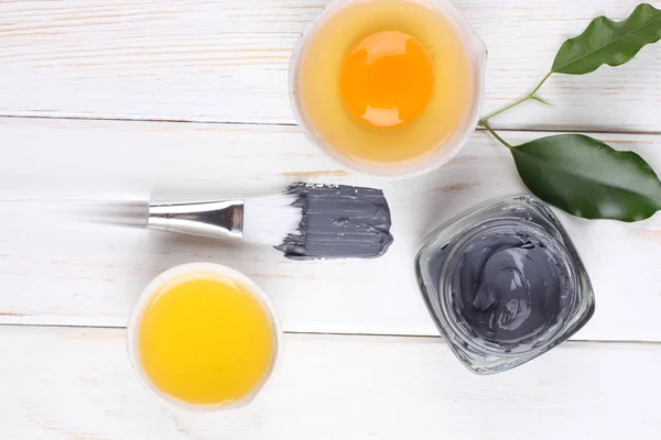top view on organic cosmetics set with creams and egg yolk