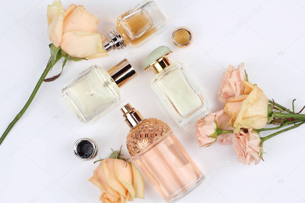set of aroma perfumes with flowers or plant on white background